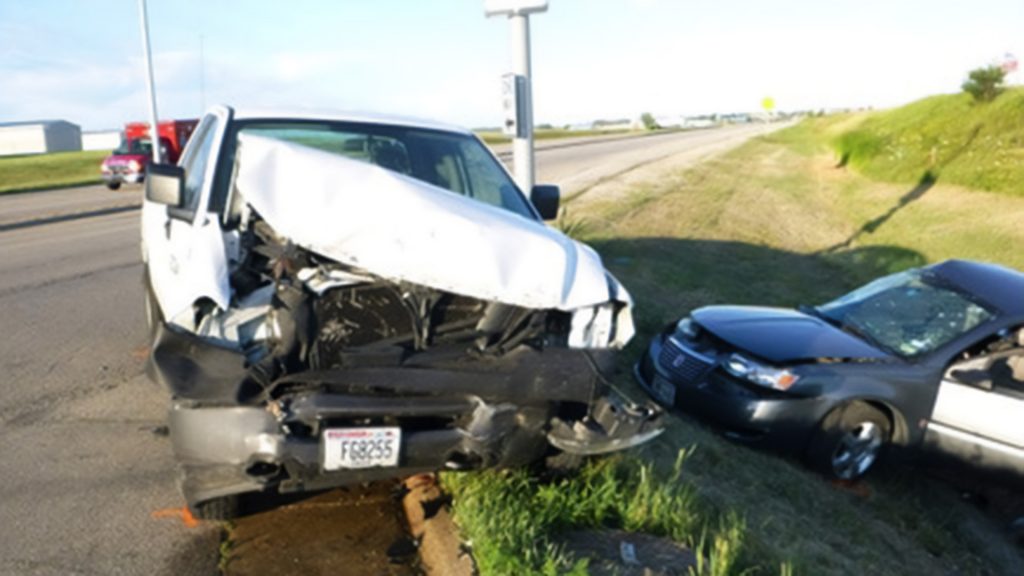 white truck and sedan in accident