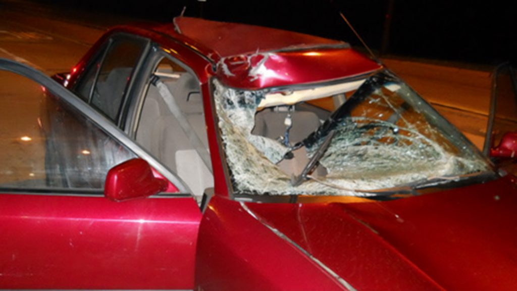 red car smashed in