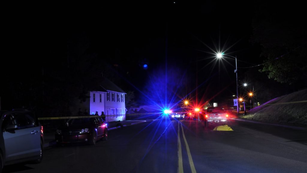 accident scene at night with police car