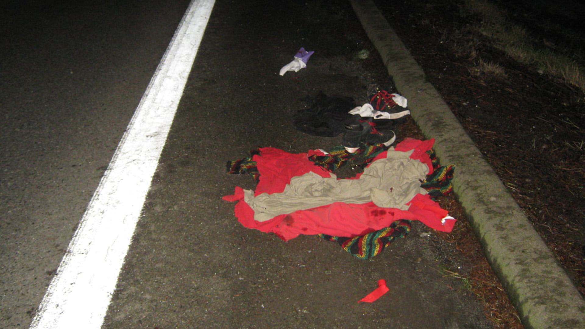 Victim's clothes on side of roadway